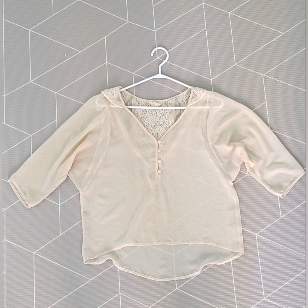 Pins and needles off white blouse. Side small.
